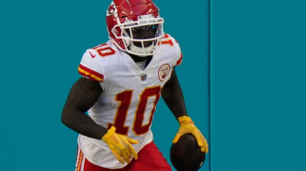 Kansas City Chiefs wide receiver Tyreek Hill (10) scores a touchdown during the second half of an NFL football game against the Miami Dolphins, Sunday, Dec. 13, 2020, in Miami Gardens, Fla. (AP Photo/Lynne Sladky)