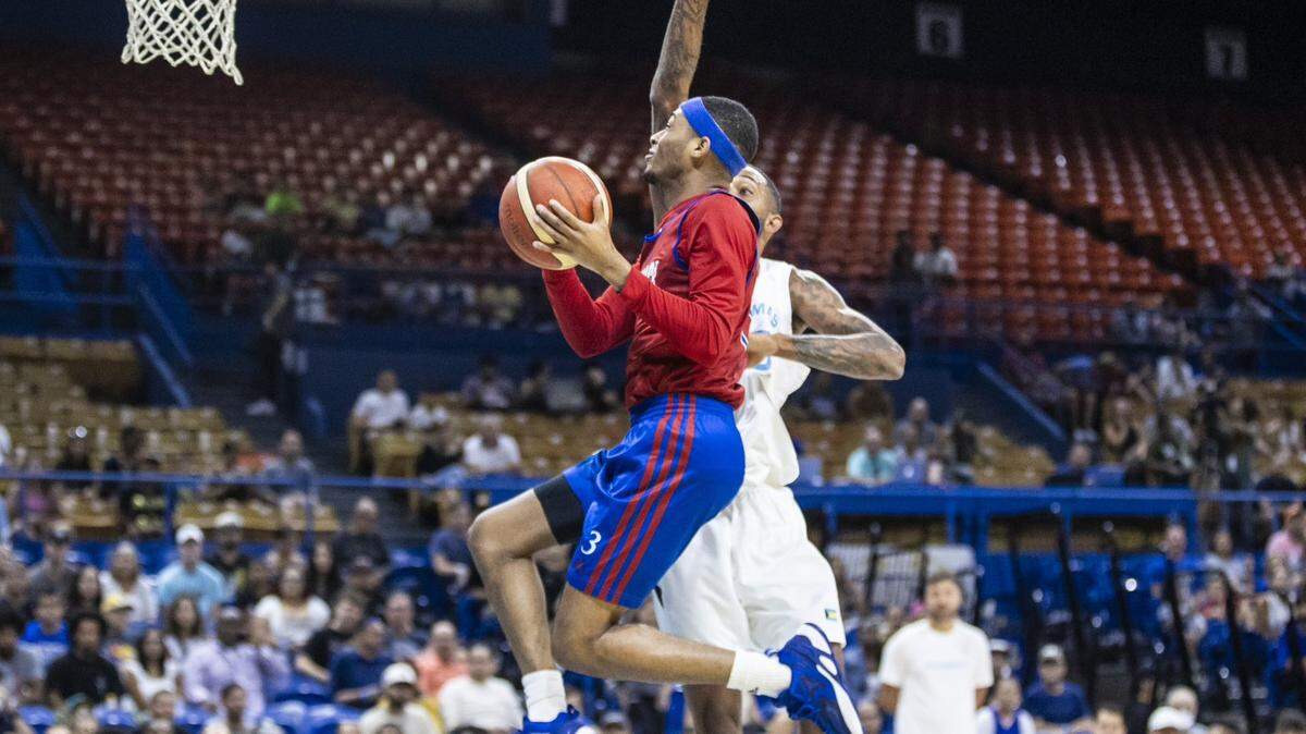 KU basketball point guard Dajuan Harris drives to the basket during a game against the Bahamas National Team in Puerto Rico on Monday, Aug. 7, 2023.