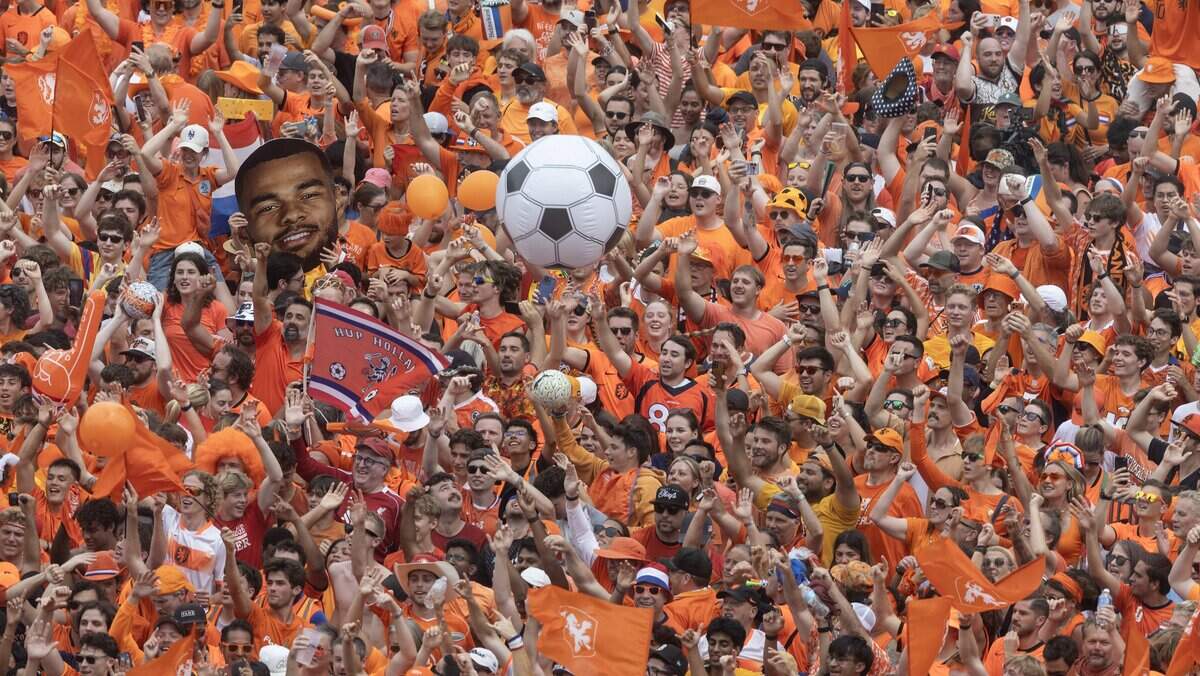 Netherlands soccer fans party at the intersection of Grand and Pershing in downtown Kansas City on Thursday, June 25, 2026.