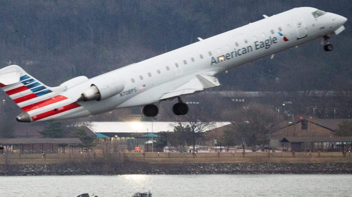 The wreckage of the American Airlines passenger jet is visible as flights take off at Ronald Reagan Washington National Airport on Friday, Jan. 31, 2025, days after it collided with an Army Black Hawk helicopter, resulting in the deaths of 67 people.