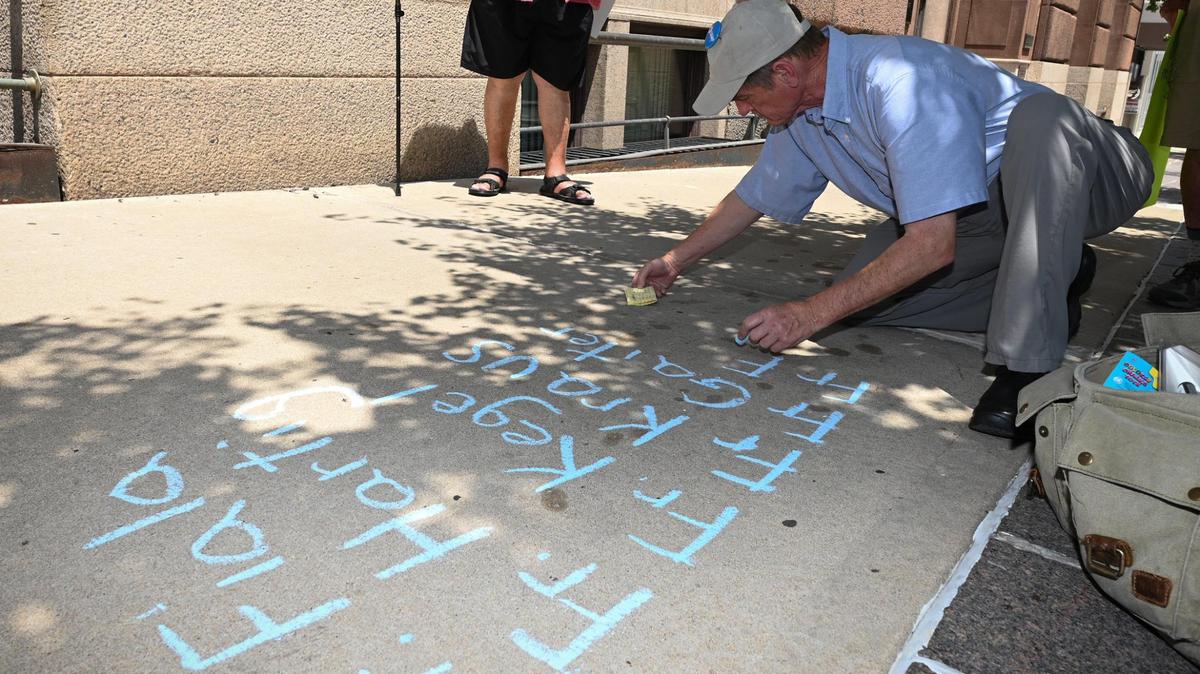 David Clohessy of SNAP, the Survivors Network of those Abused by Priests, on Wednesday wrote the names of priests credibly accused of sexual abuse outside the Kansas City-St. Joseph Diocese, 20 W. 9th St. in Kansas City. SNAP said priests who once worked in the Kansas City diocese and were credibly accused of abuse elsewhere were left off the diocese’s list of abusers.