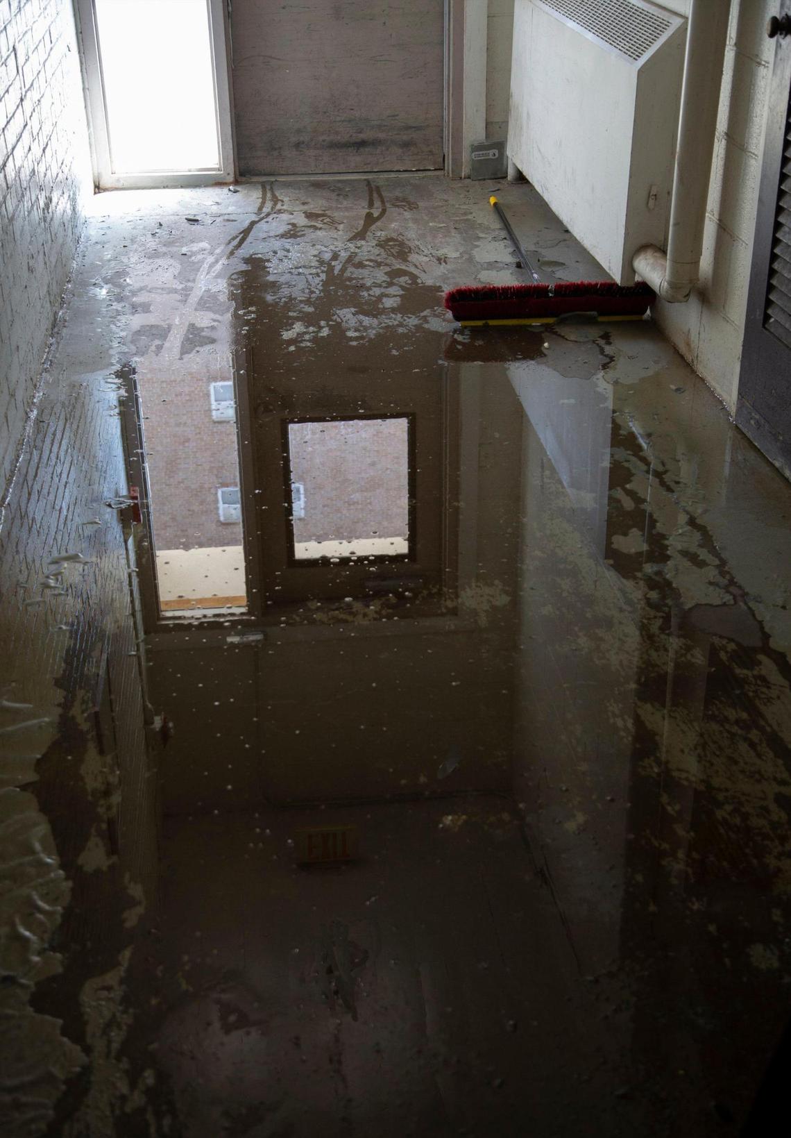 A hall flooded at Quality Hills Towers is just one of the many problems residents have had at the building at 8th and Jefferson in downtown Kansas City.