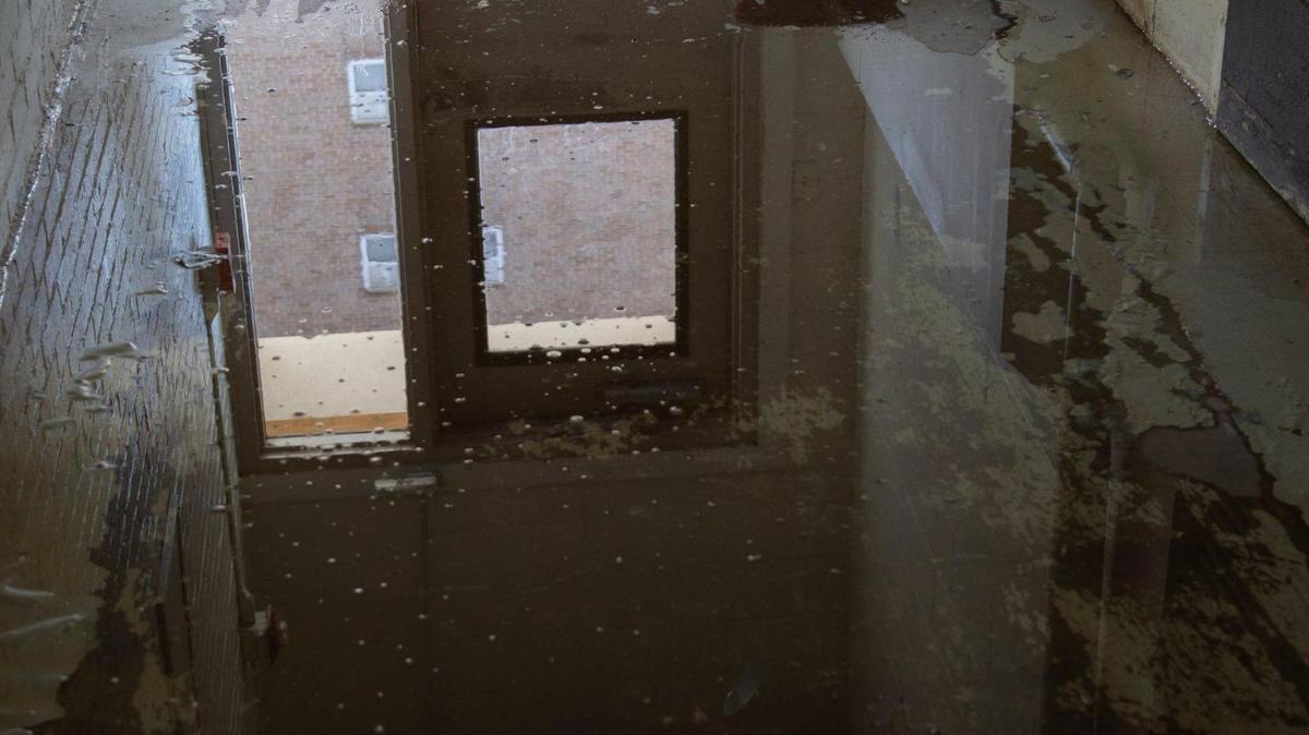 A back hall flooded at Quality Hills Towers just one of the many problems residents have had.