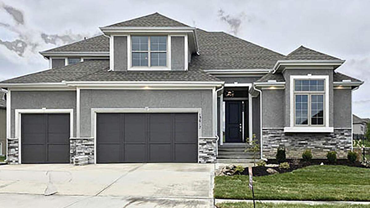 Ryan Homes recently completed this 1 ½-story Riviera floor plan, 13017 W. 170th St., featuring dramatic two-story ceilings in the great room and dining room, a full wall of glass and floor-to-ceiling tiled fireplace, a covered patio, two bedrooms on the main level and two bedrooms on the second floor with balcony overlook and a white enameled kitchen with GE appliance package. This home can be yours within 30 days, priced at $479,950.