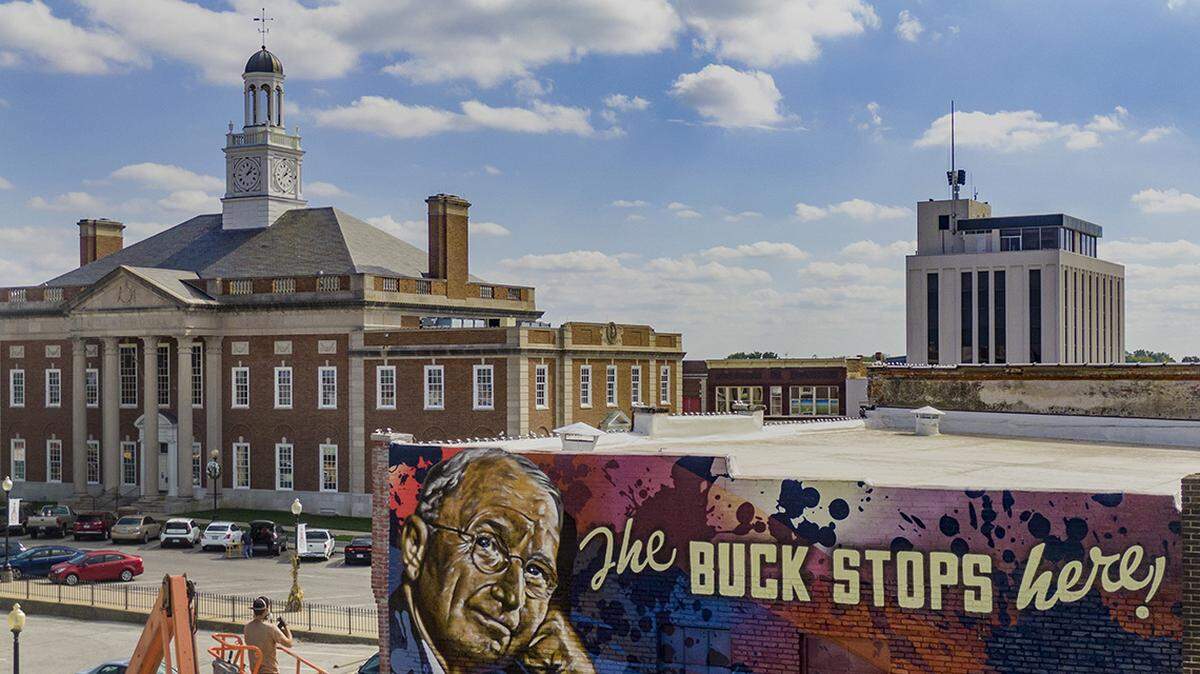 Graffiti artist and muralist, ARCY, takes a look at his work on an over-sized mural of former President Harry S. Truman and his famous saying on the side on of a building on Wednesday, Oct. 20,  at 206 N. Liberty St. on Independence Square.  The mural was commissioned by residents in Independence and sits in close proximity to the historic Truman Courthouse. 