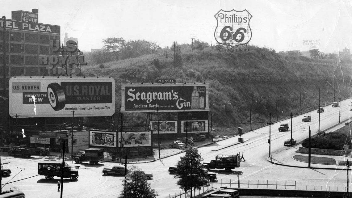 In 1949, when the photo at top was taken, the bluff at Pershing and Main was known as Signboard Hill. 