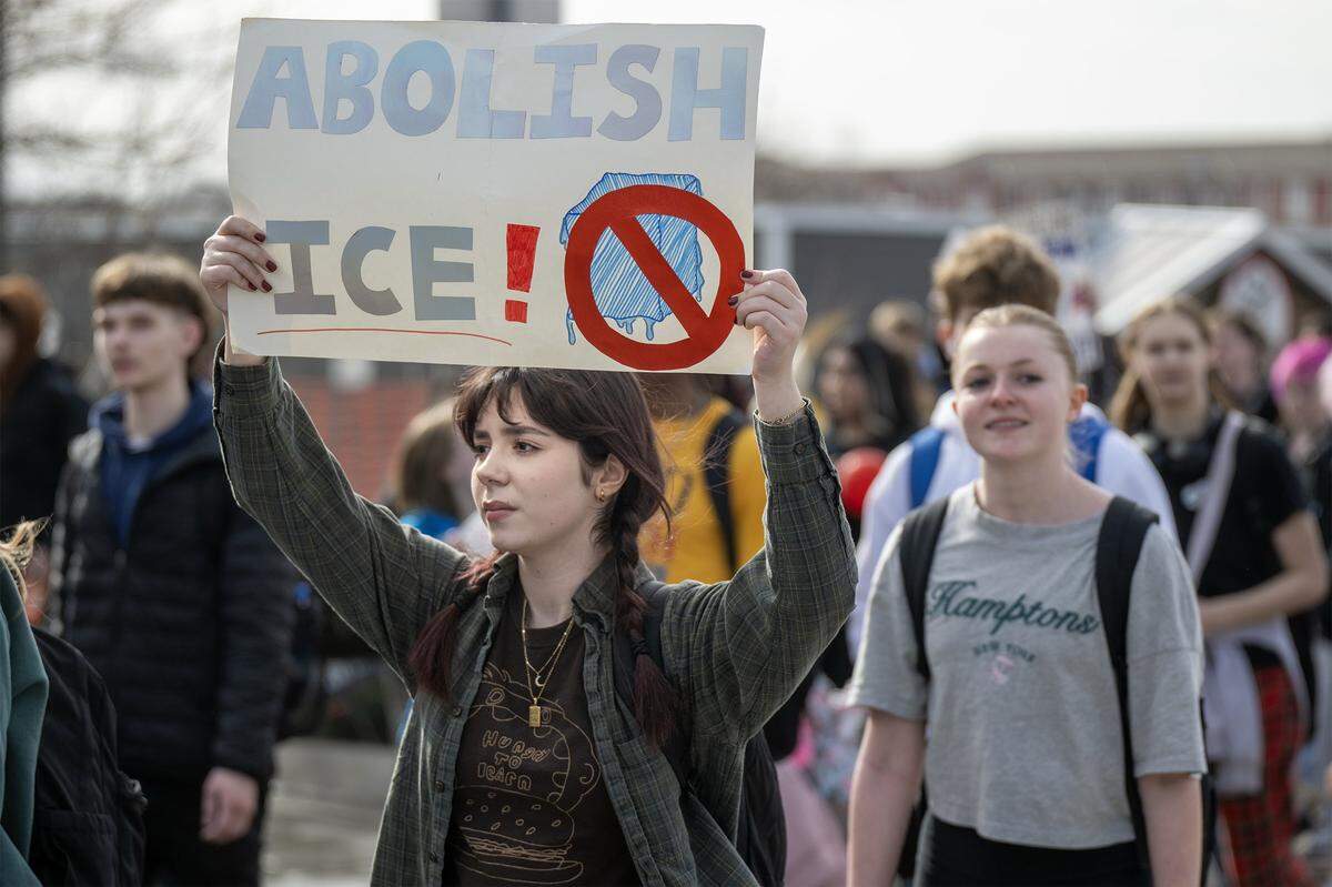 Students at Shawnee Mission North High School marched in protest of ICE and the Trump administration's policies along Johnson Drive on Wednesday, February 11, 2026, in Overland Park.
