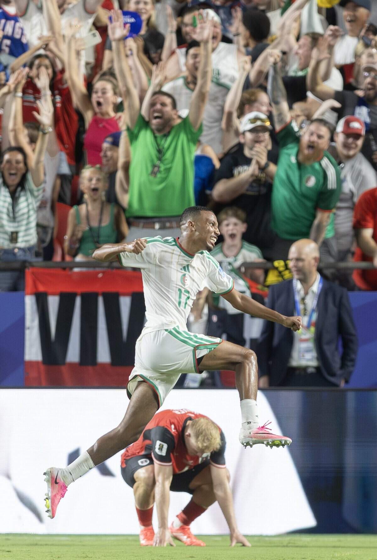 Algeria defender Rafik Belghali (17) celebrates a goal against Austria during a FIFA World Cup group-stage soccer match at Kansas City (Arrowhead) Stadium in Kansas City on Saturday, June 27, 2026.