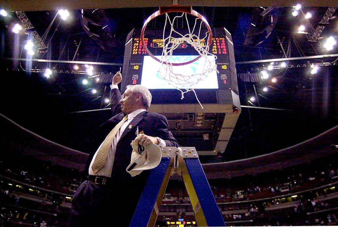 Roy Williams helped cut down the net after Kansas beat Arizona and advanced to its second consecutive Final Four in 2003.