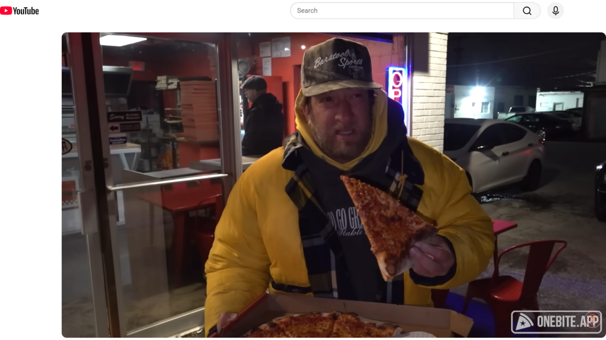 Dave Portnoy standing in the cold reviewing Pizza Tascio at 1111 Burlington St. in North Kansas City on Saturday.