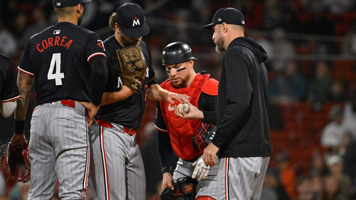Minnesota Twins manager Rocco Baldelli (5) relives pitcher Cole Irvin (24) of pitching duties during the sixth inning of Sunday’s game against the Boston Red Sox at Fenway Park.