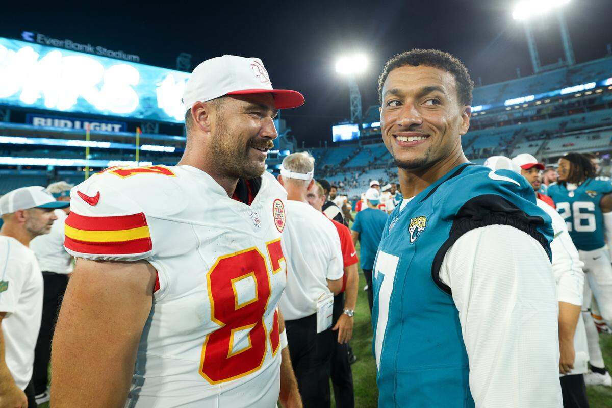 Kansas City Chiefs tight end Travis Kelce (87) greets Jacksonville Jaguars tight end Evan Engram (17) after a preseason game at EverBank Stadium.