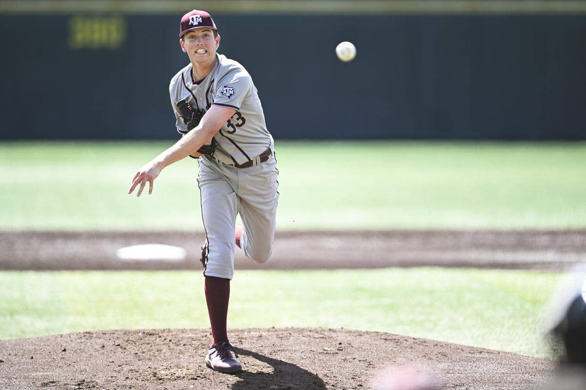 Justin Lamkin #33 of the Texas A&M Aggies throws a pitch against the Tennessee Volunteers in the first inning at Lindsey Nelson Stadium on March 26, 2023 in Knoxville, Tennessee.