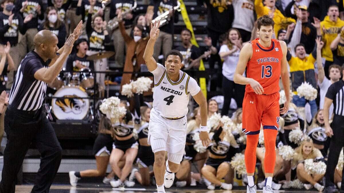 Missouri’s Javon Pickett celebrates a three-point basket in front of Auburn’s Walker Kessler during the first half Tuesday, Jan. 25, 2022, in Columbia, Mo. Missouri took No. Auburn to the wire but was unable to come away with the upset.