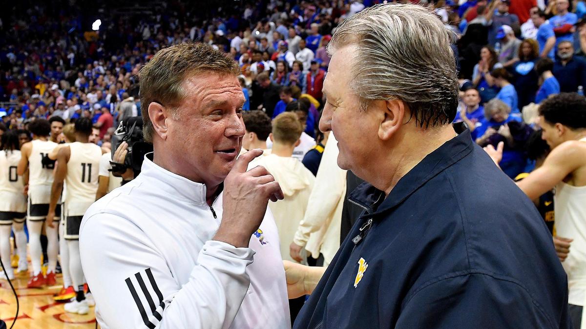 Kansas coach Bill Self, left, chats with West Virginia coach Bob Huggins after the Jayhawks beat the Mountaineers at Allen Fieldhouse in the 2022-23 season.