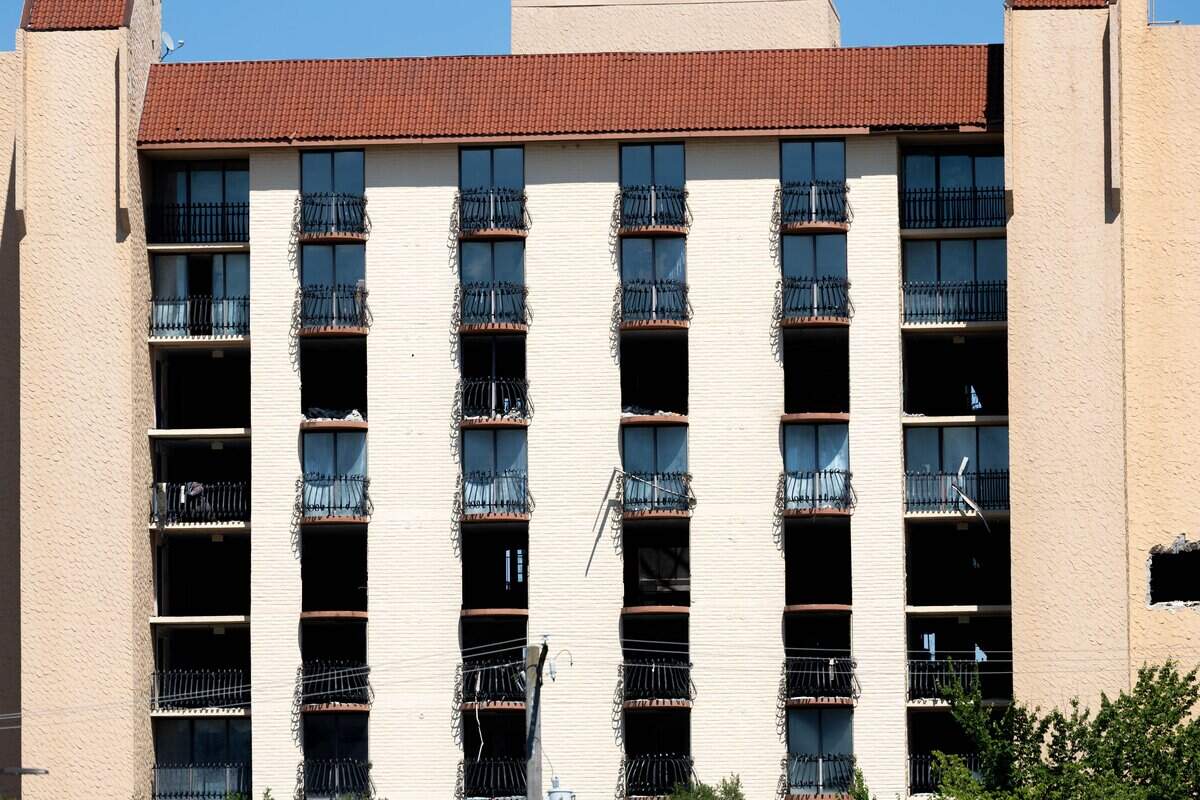 A close-up of the former Embassy Suites building, owned by Saint Lukes Hospital before it is imploded on Sunday, July 12, 2026. Saint Luke's plans to use the lot for staff parking while reserving it for future campus development.