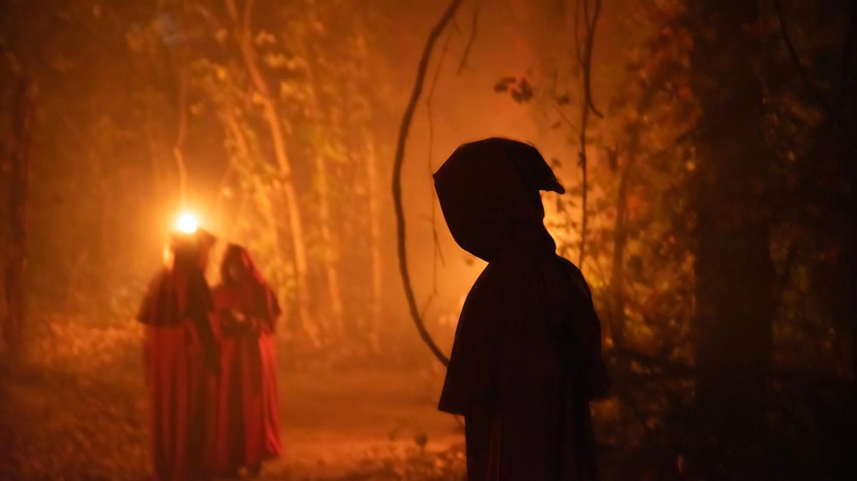 Mysterious hooded figures awaited visitors to perform a ghastly ceremony at Exiled KC-Crooked Rose Woods.
