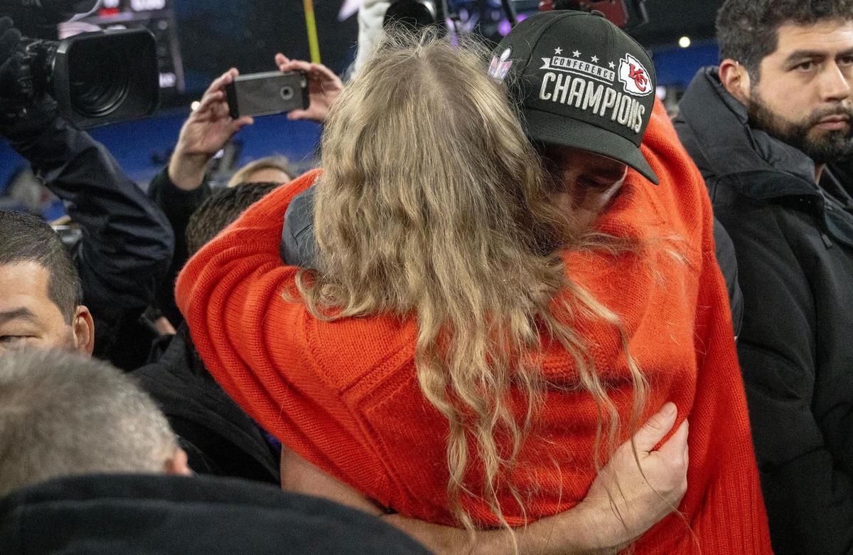 Kansas City Chiefs tight end Travis Kelce (87) hugs pop star Taylor Swift after the Chiefs defeated the Baltimore Ravens 17-10 in the AFC Championship Game on Sunday, Jan. 28, 2024, in Baltimore.
