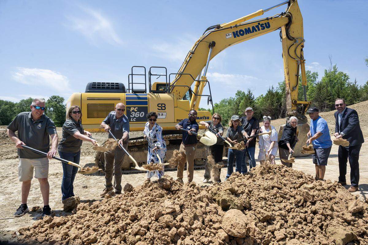 Board members of Eden Village and others including Mayor Christal E. Watson and Andrew Davis, commissioner, gathered for a groundbreaking for Eden Village KC II on Tuesday, May 12, 2026, at 1300 N. 59th St., in Kansas City, Kansas. The new tiny home community will provide housing and support services for those experiencing chronic homelessness. Attending were (from left) Kevin and Cindy O’ Dower, Marilyn Simpson, Brad Simpson, Mayor Christal E. Watson, Commissioner Andrew Davis, Kerry Poolman, Katrina Gerber, Phil Jorgenson, resident Cariann Lile, Jennifer and Jim Schmidt, and Derrick Loutsch.