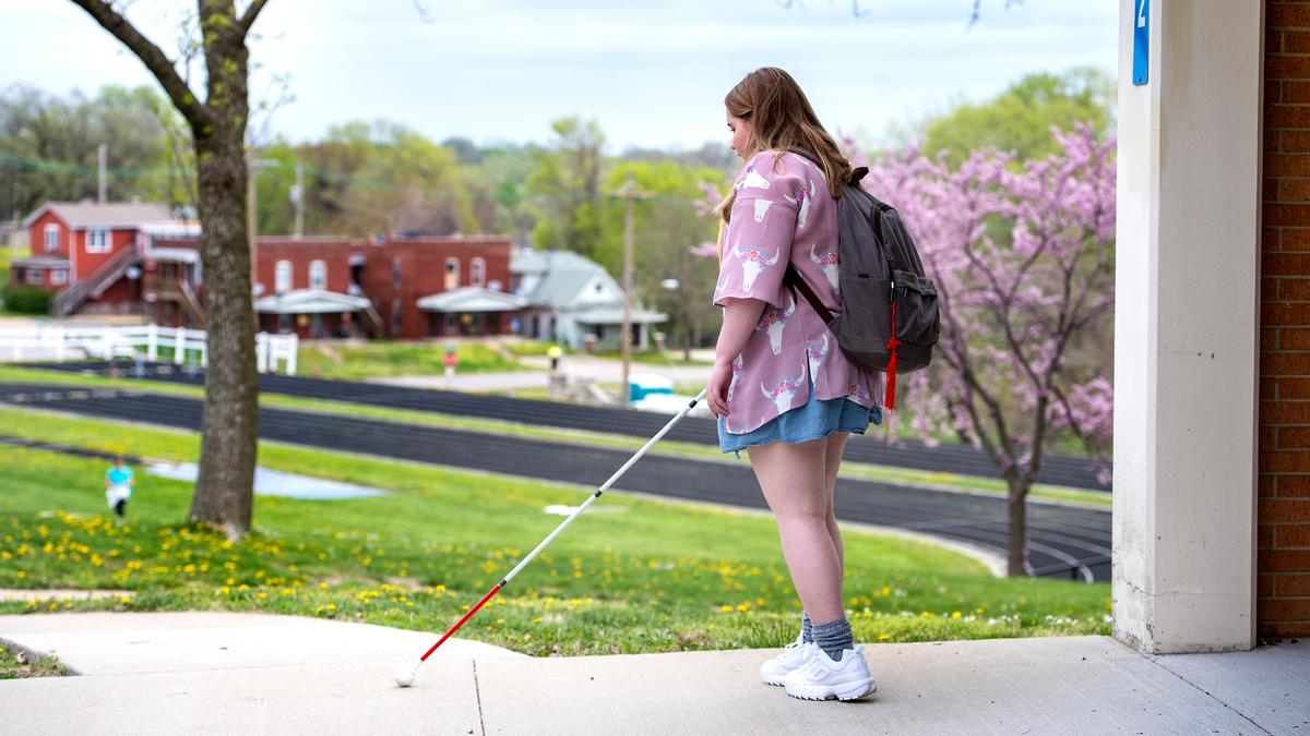 Using her cane, Jordyn Walker, 16, finds her way around at Kansas State School for the Blind, where she is learning mobility and orientation, among other skills.