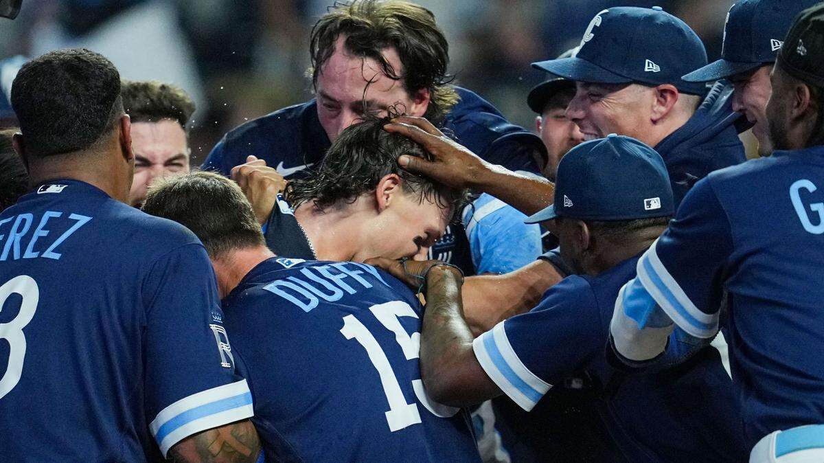 Kansas City Royals shortstop Bobby Witt Jr. (7) celebrates with teammates after hitting a walk-off grand slam against the Minnesota Twins during the 10th inning at Kauffman Stadium on July 28, 2023.