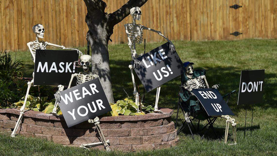 The CDC has listed Halloween trick-or-treating as a high-risk activity during the pandemic, but parents are still going to let their kids make the rounds. Here, Kenneth Torres of Overland Park made the point that people need to take COVID-19 precautions seriously.