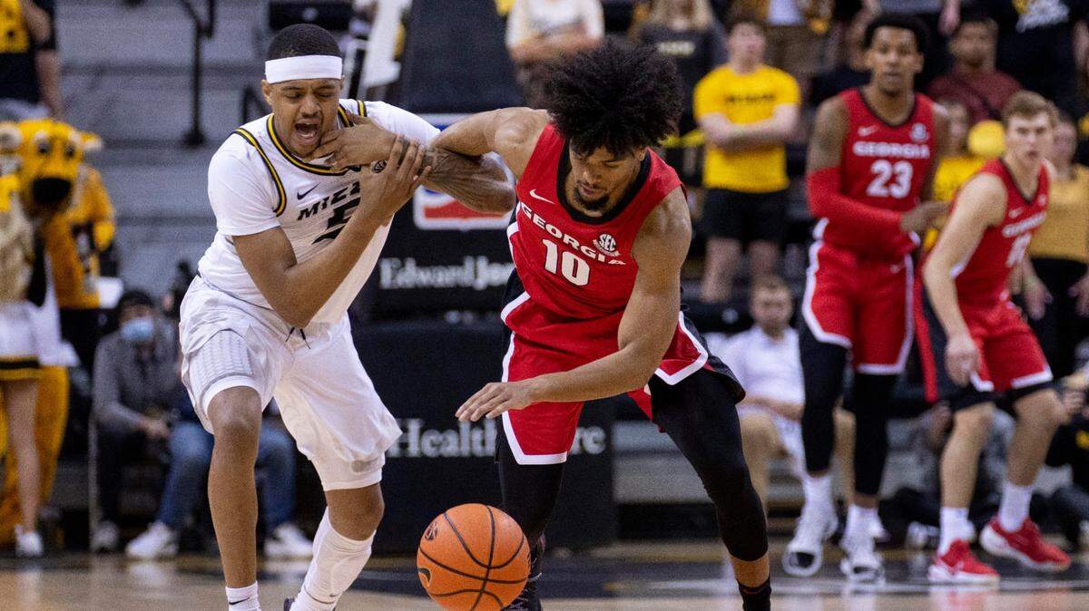 Georgia’s Aaron Cook, right, steals the ball from Jarron Coleman, left, during the first half of an NCAA college basketball game Saturday, March 5, 2022, in Columbia, Mo. (AP Photo/L.G. Patterson)