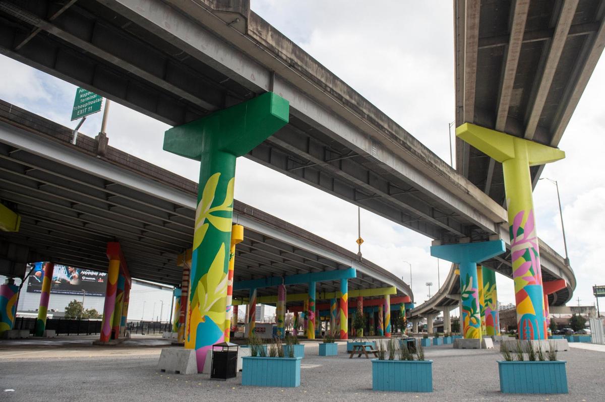 Bright paint decorates the site of a future food truck area under an I-10 overpass in New Orleans on Thursday, Jan. 30. The space was previously the site of a homeless encampment.