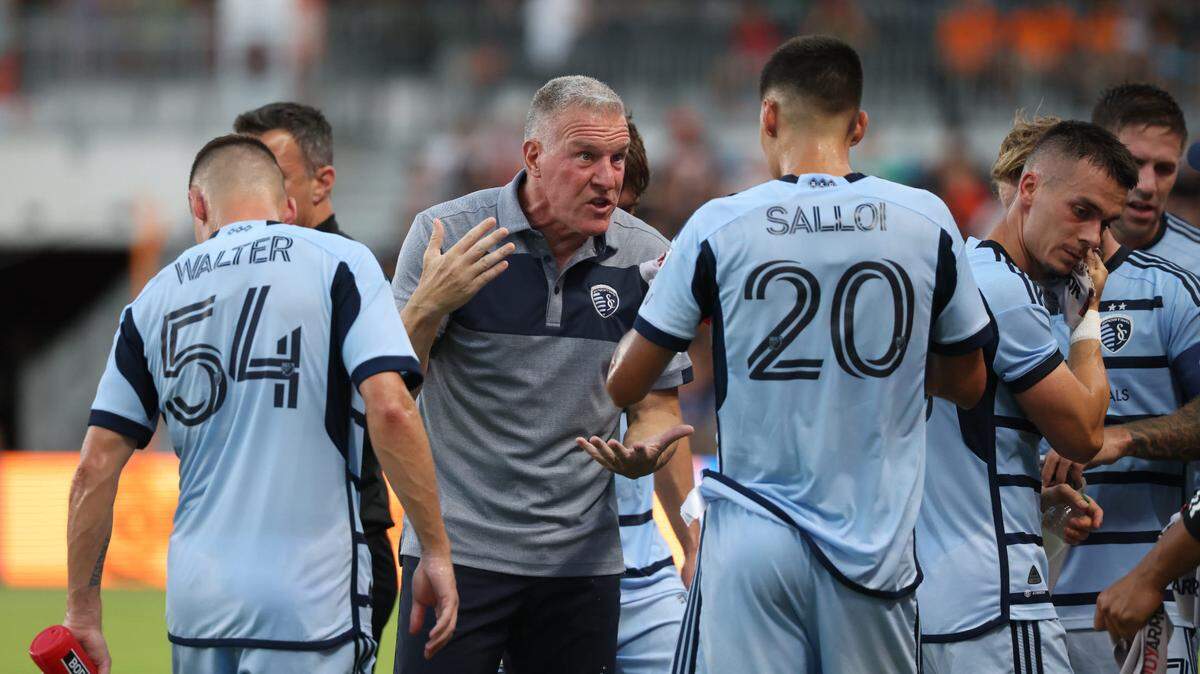 Sporting Kansas City head coach Peter Vermes gives instructions to forward Daniel Salloi (20) during the first half against the Houston Dynamo at Shell Energy Stadium on July 8, 2023.