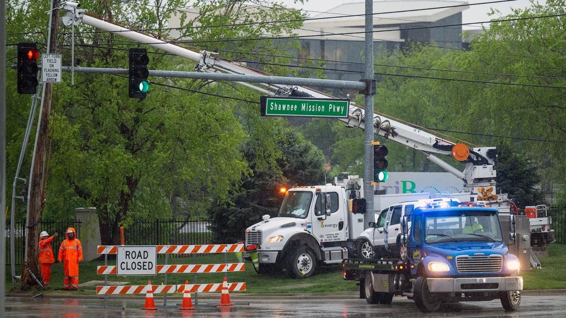 Heavy rain fell as crews from Evergy were on the scene after a motor vehicle accident last week at Shawnee Mission Parkway and Long Street in Shawnee, Kansas.