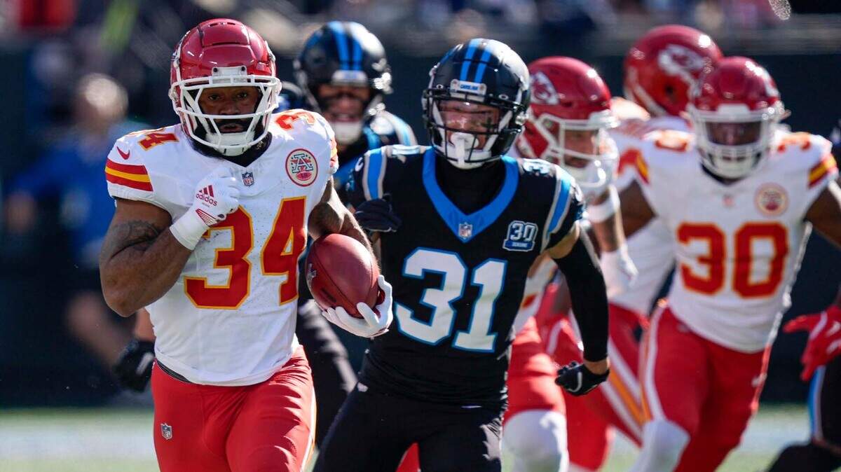Kansas City Chiefs running back Samaje Perine (34) runs the kickoff against the Carolina Panthers during the first quarter at Bank of America Stadium.