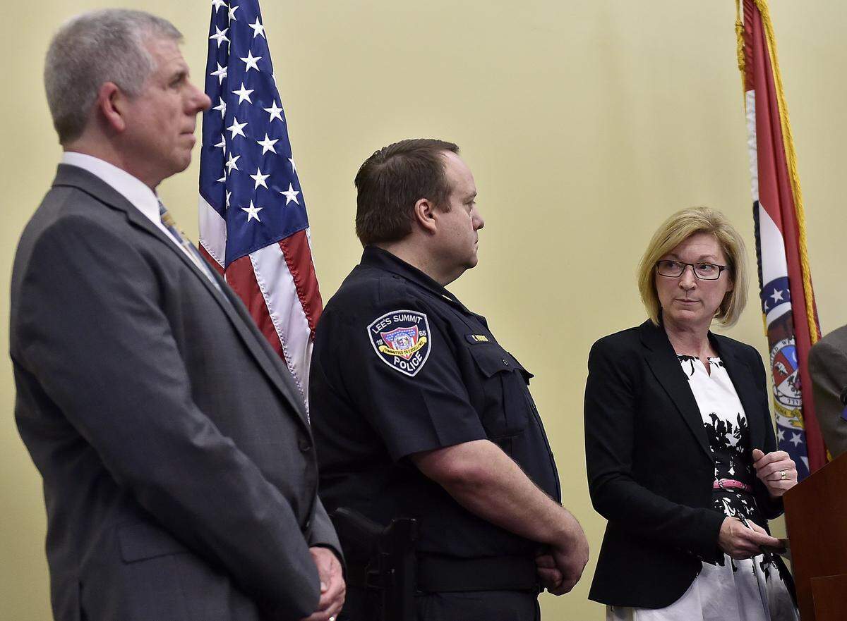 Assistant prosecutor Michael Hunt (from left) and Lee's Summit police chief Travis Forbes Jackson County speaks, Prosecutor Jean Peters Baker announced Thursday that Nicholas M. Webb, 58, has been charged with second-degree murder and armed criminal action in the stabbing death of Cody Harter, 23, Saturday. Police believe a road rage incident led to the death of Harter, a Missouri Air National Guard member. Webb had previously been convicted of murder in 1981. 