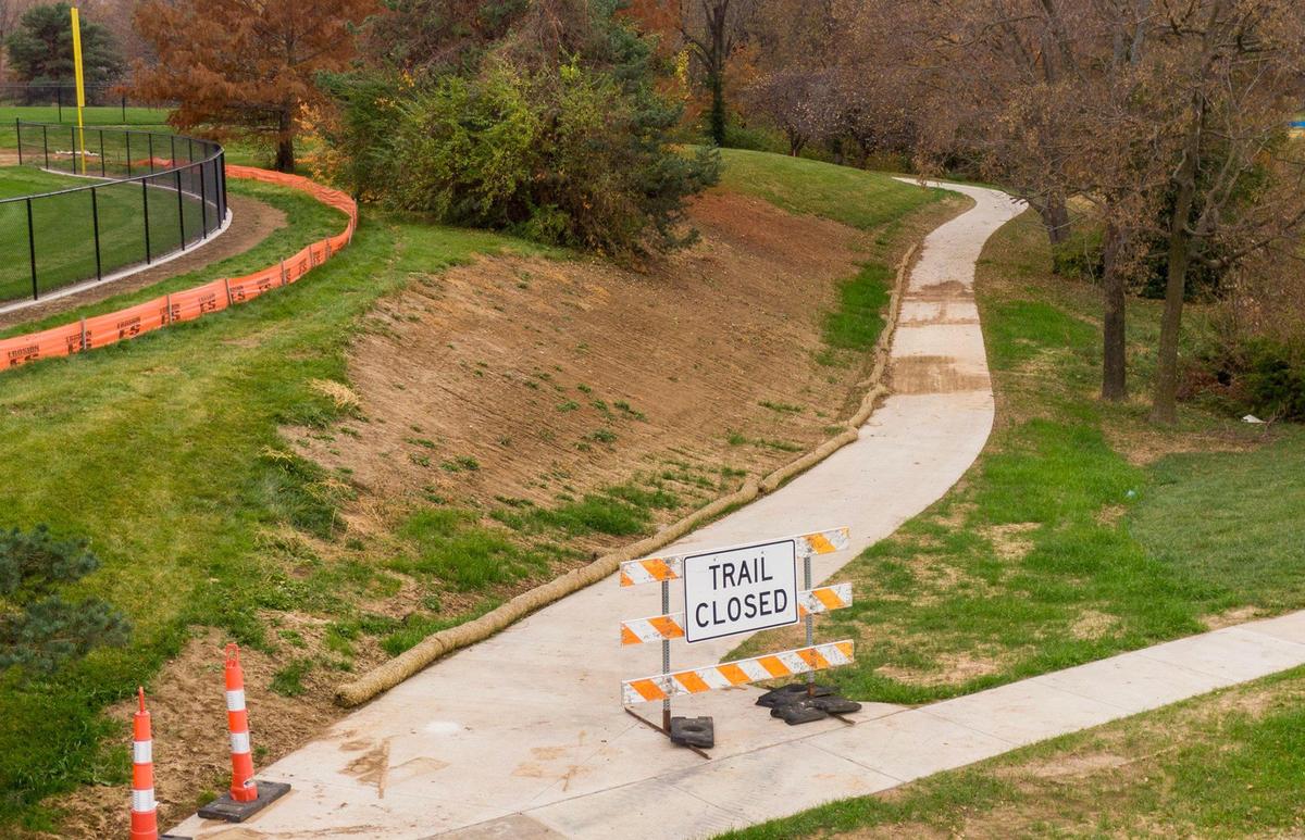 A new concrete pathway replaces the old asphalt path around the perimeter of Gum Springs Park.