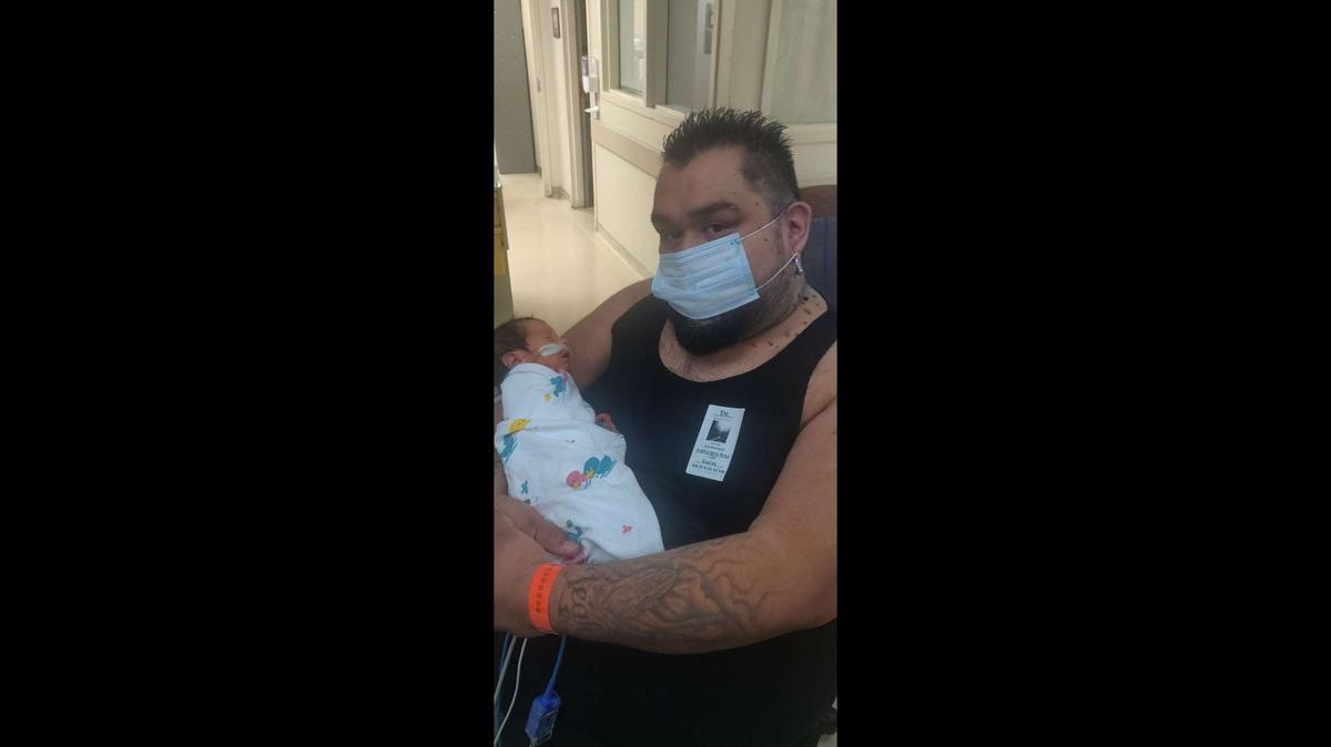 Joey Marquez with his new son Ezra, born in May.
