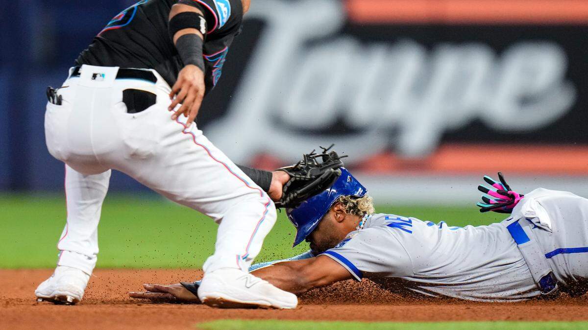 Miami Marlins second baseman Luis Arraez, left, tags out Kansas City Royals right fielder MJ Melendez during the fourth inning Wednesday at LoanDepot Park in Miami.