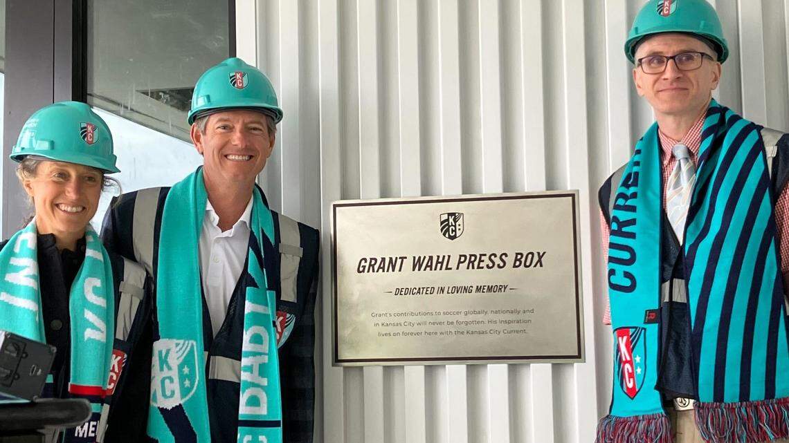 Kansas City Current co-owners Angie and Chris Long stand with Eric Wahl, brother of late soccer writer Grant Wahl, at a Thursday ceremony dedicating the new CPKC Stadium’s press box the “Grant Wahl Press Box.”