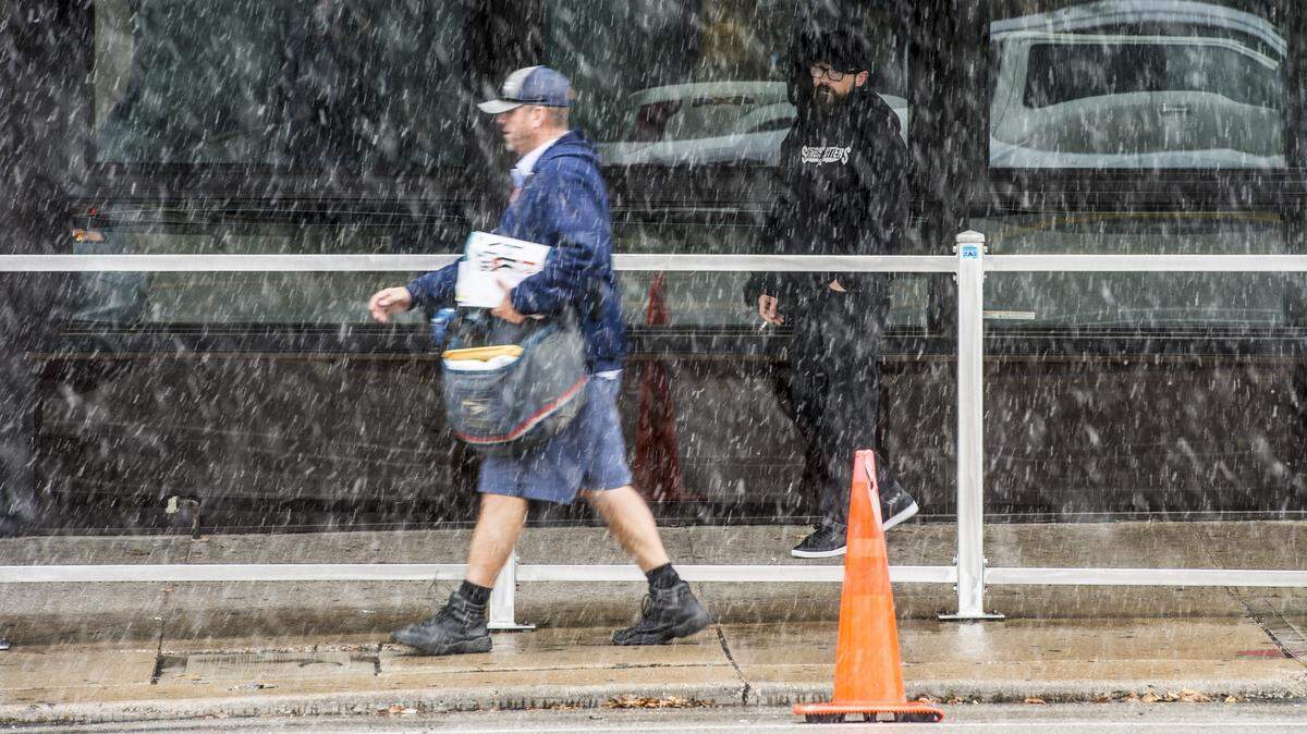 A postal employee delivers mail in the Kansas City area.