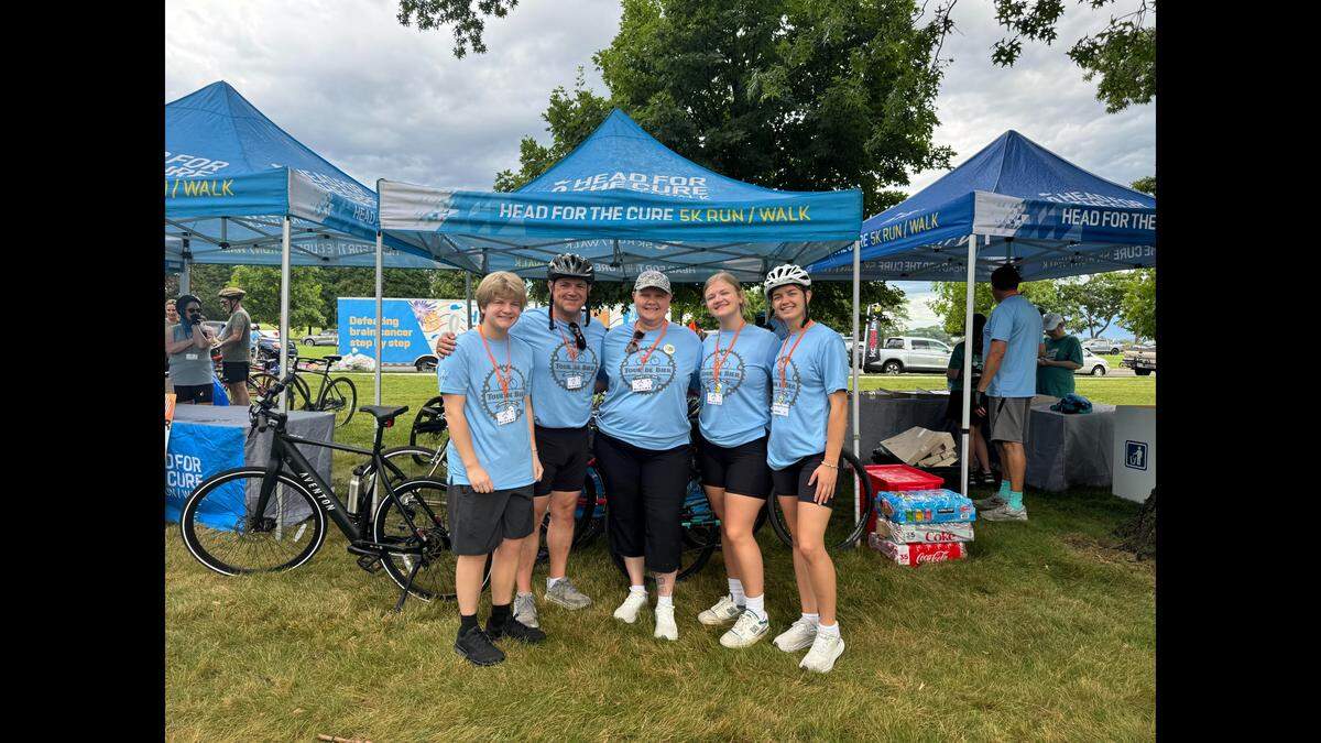 The Gerend family, of North Kansas City, has been coping with a cancer diagnosis for the past 16 or so months. Amy Gerend, center, was diagnosed with Glioblastoma, a Stage 4 brain tumor. Mary Gerend, far right, is spending the month of April biking 300 miles to raise money for cancer research in honor of her mom. All money raised will go to Head for the Cure Foundation in KC. Last year, the family attended another fundraiser together.