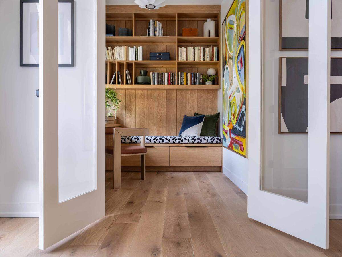 Hamilton hung a large piece of art in the home office to serve as a colorful Zoom background.