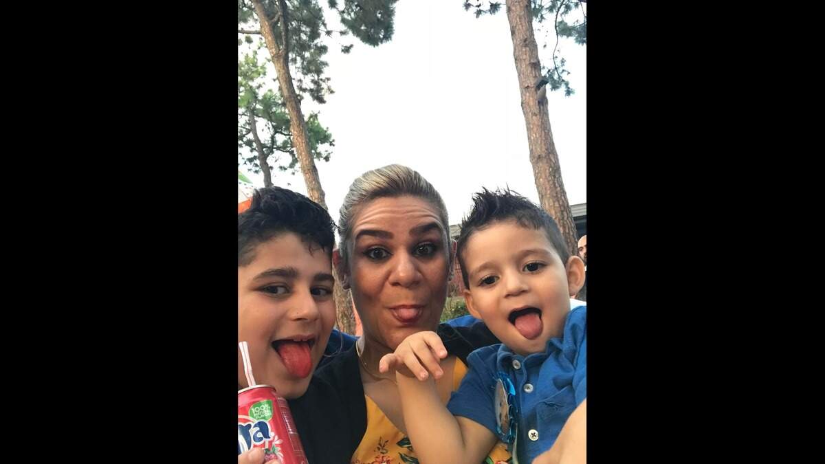 Noora Al Mafraji takes a selfie with her two sons, Yazin and Nezar. Noora was known for her devotion to family, work and selfless acts for others.