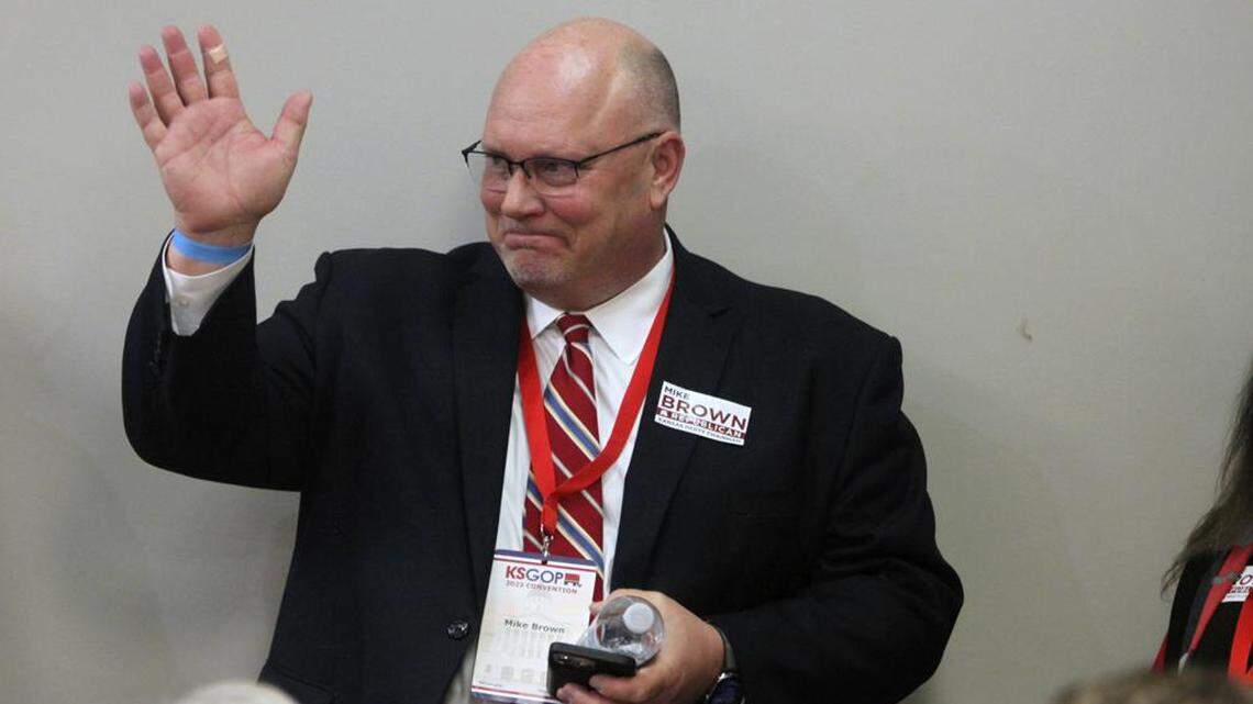 Mike Brown, an Overland Park, Kan., Republican activist, greets fellow activists from the 2nd Congressional District of eastern Kansas during a state convention, Saturday, Feb. 11, 2023, in Topeka, Kan. Brown was a candidate to be state chair and lead the party through the 2024 election in a contentious contest that mirrored infighting in the GOP across the