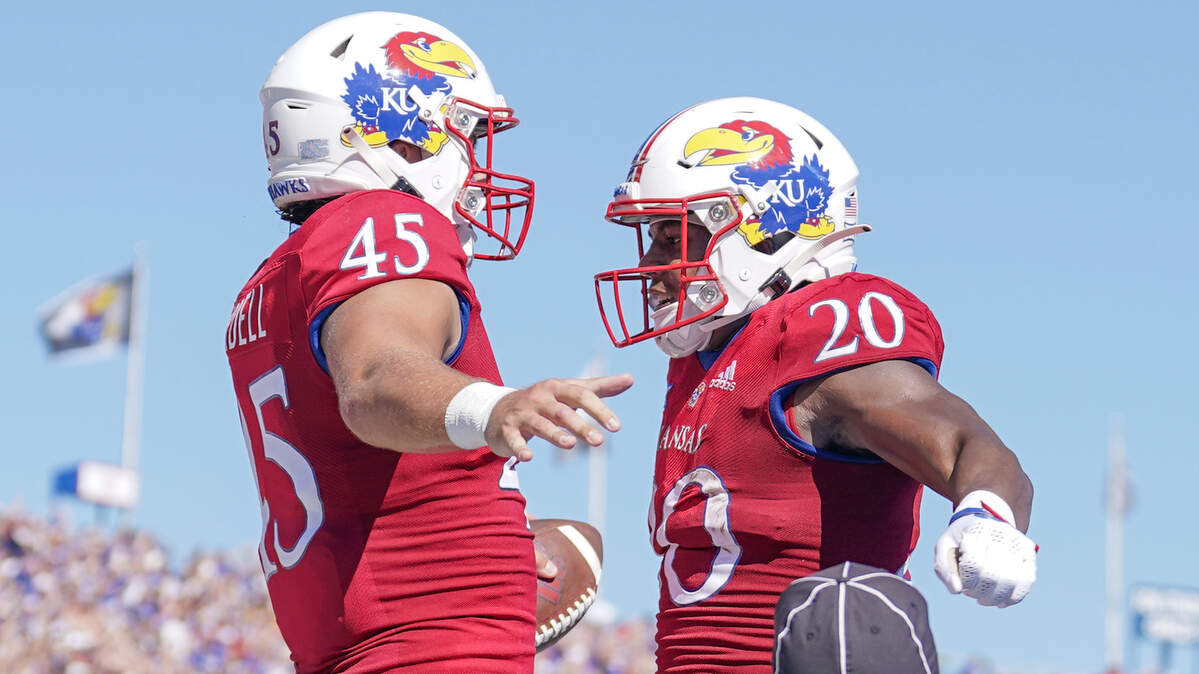 Kansas Jayhawks tight end Trevor Kardell (45) celebrates with running back Daniel Hishaw Jr. (20) after scoring against the Duke Blue Devils during the first half at David Booth Kansas Memorial Stadium on Sept. 24, 2022.