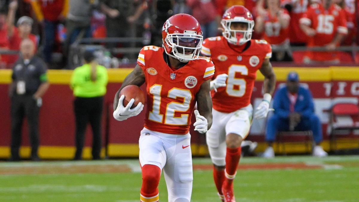 Kansas City Chiefs wide receiver Mecole Hardman Jr. (12) returns a punt against the Los Angeles Chargers during an NFL football game at GEHA Field at Arrowhead Stadium on Monday, Oct. 23, 2023, in Kansas City.