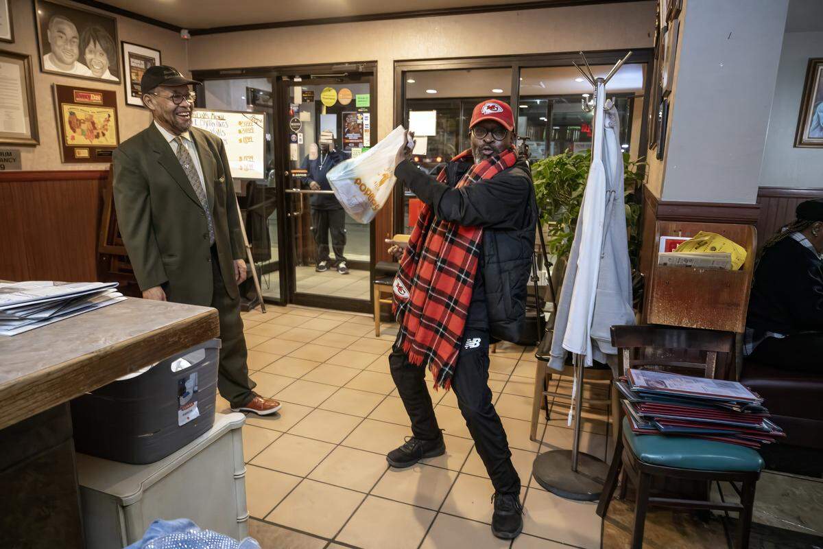 Perry Ward (left) looks on as Kansas City resident Richard Strong breaks into a dance while owner Denise “Ms. Niecie” Ward performs old-school hits at Niecie's Restaurant during “Dinner & A Show” on Friday, Feb. 6, 2026. Perry and Denise Ward opened Niecie's restaurant in 1985.