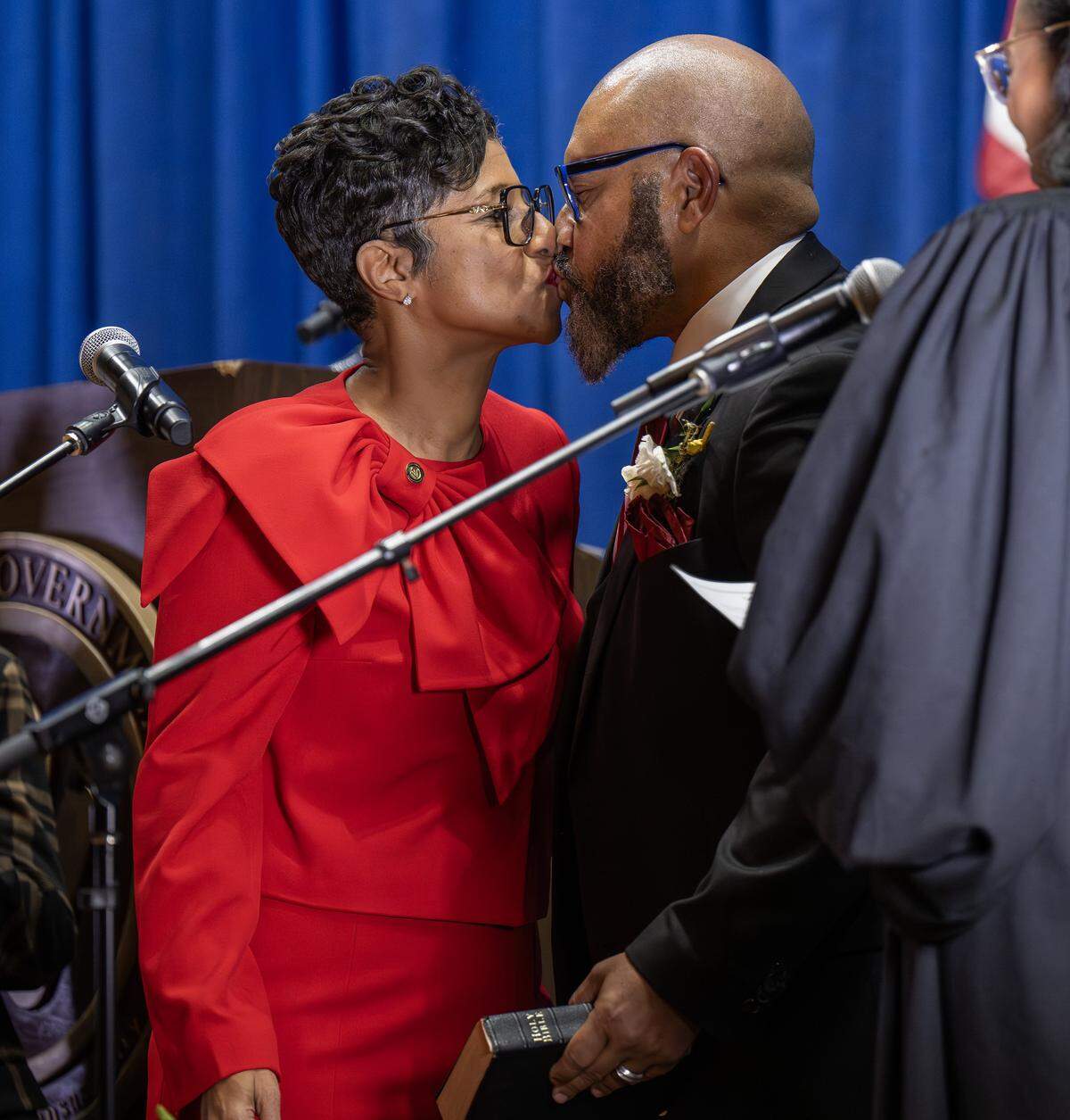 Christal E. Watson kisses her husband after being sworn in as Wyandotte County Unified Government CEO and mayor during an inauguration ceremony at Memorial Hall on Monday, Dec. 15, 2025, in Kansas City, Kansas.