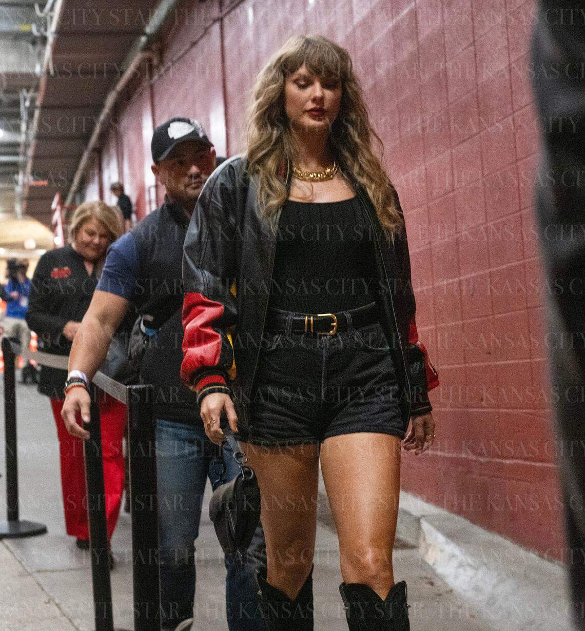 Pop star Taylor Swift is escorted by security to attend an NFL game between the Kansas City Chiefs and Tampa Bay Buccaneers on Monday, Nov. 4, 2024, at GEHA Field at Arrowhead Stadium.