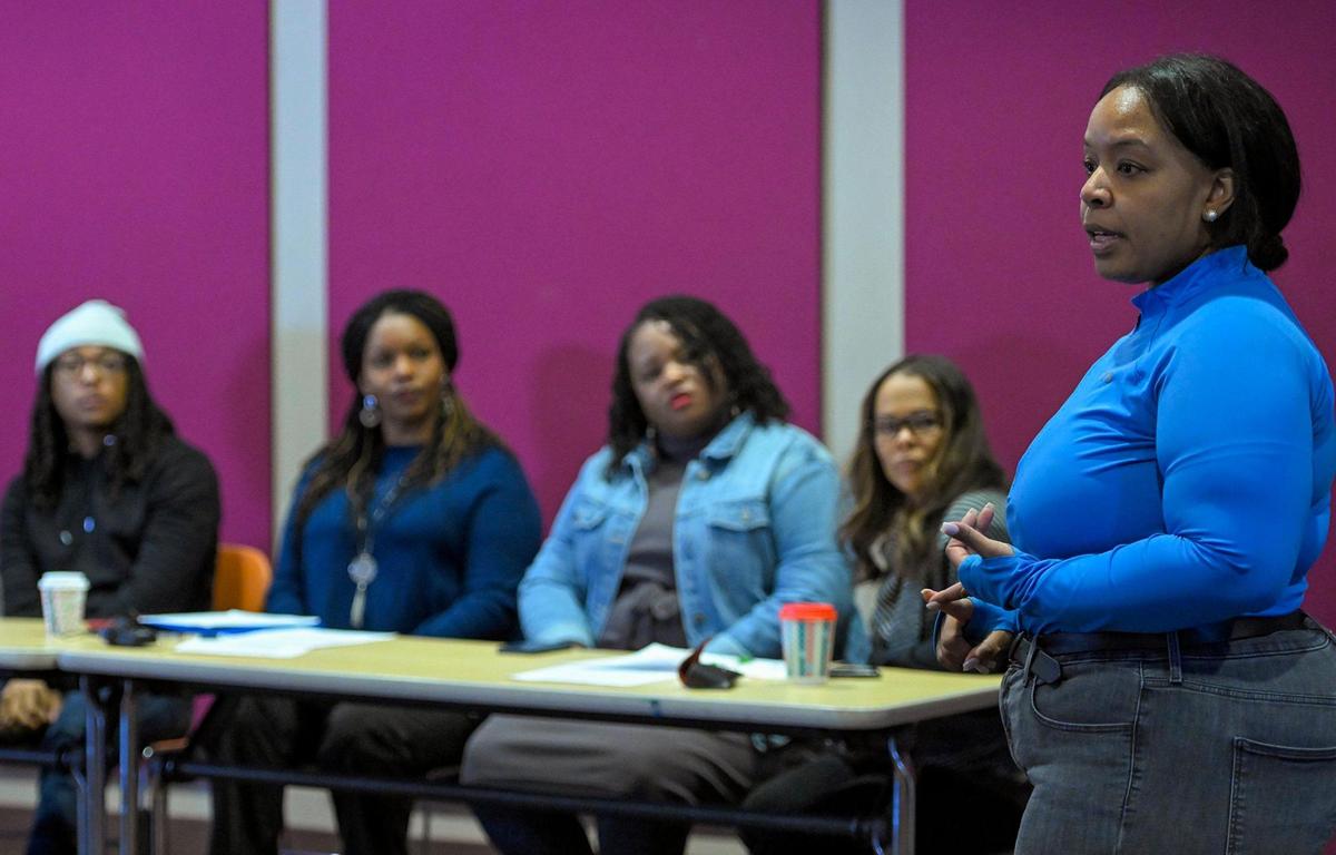 Michele Watley, right, founder of Shirley’s Kitchen Cabinet, a non-profit organization to empower Black women, talked about concerns of missing Black women, which some feel are downplayed by police and media during “Black and Missing,” a community discussion Saturday, Nov. 18, 2022, at the at the Lucile H. Bluford Branch Library.