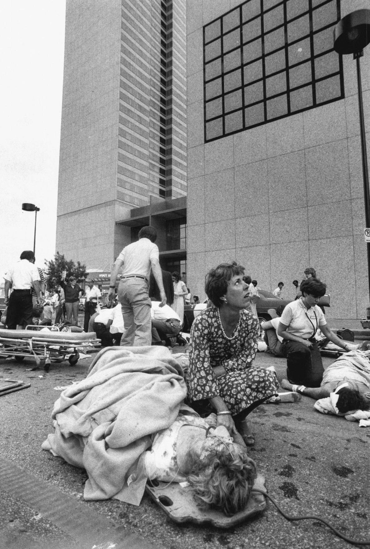 A woman who was not an emergency worker comforted a woman injured when the skywalks collapsed at the Hyatt.