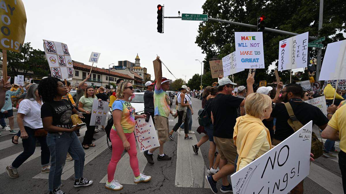 Demonstrators rally Saturday at Mill Creek Park in Kansas City as part of nationwide “No Kings” protests against the Trump administration.