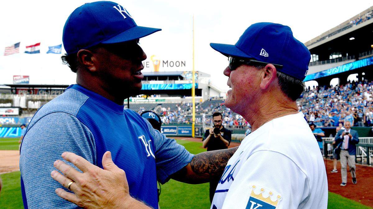 Kansas City Royals manager Ned Yost (right) embraces catcher Salvador Perez (3) after his last game before retiring against the Minnesota Twins at Kauffman Stadium on Sept. 29, 2019.